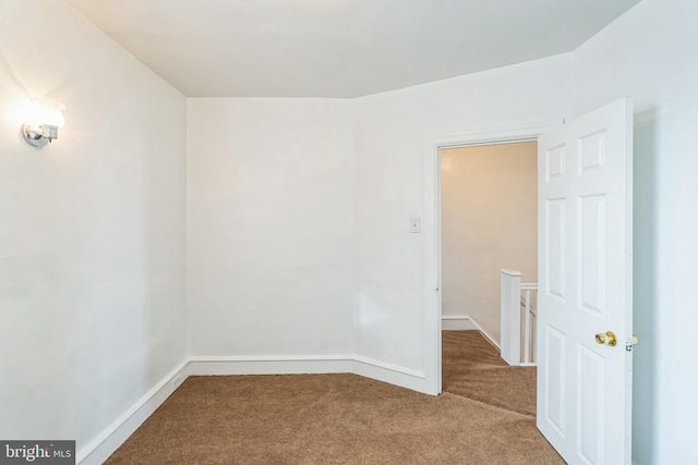 unfurnished room featuring carpet flooring