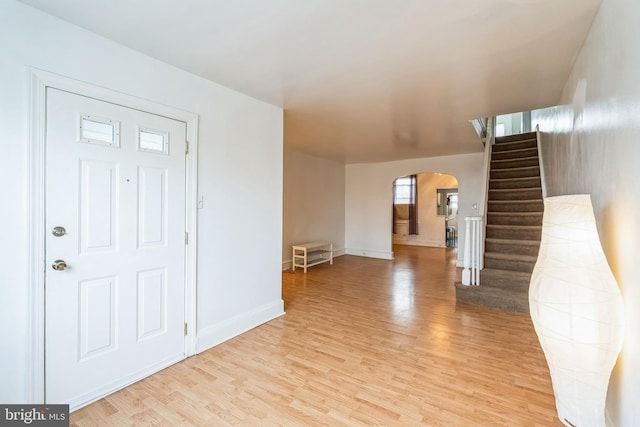 foyer entrance with light hardwood / wood-style floors