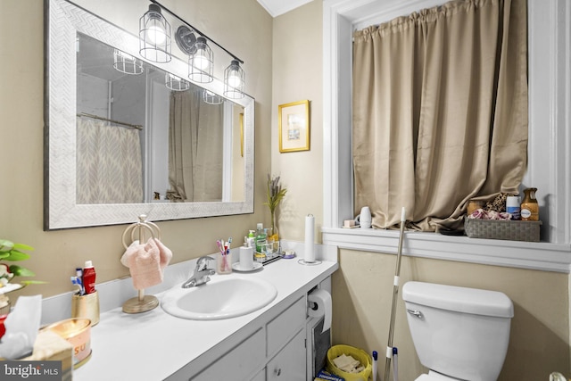 bathroom featuring vanity and toilet