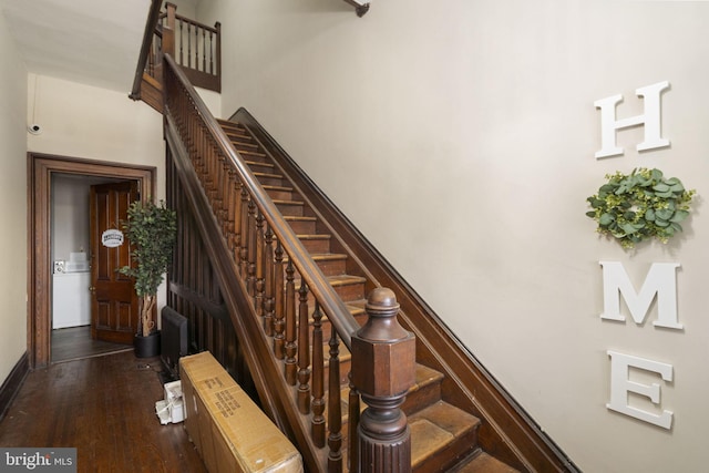 staircase with hardwood / wood-style floors