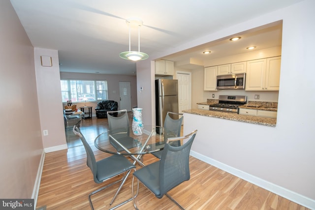 dining area featuring light hardwood / wood-style flooring