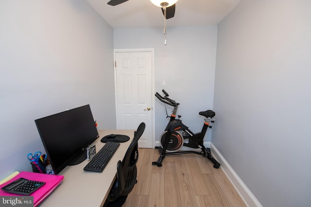 office space with light hardwood / wood-style floors and ceiling fan