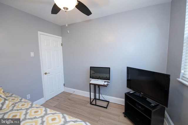 bedroom featuring light hardwood / wood-style floors and ceiling fan