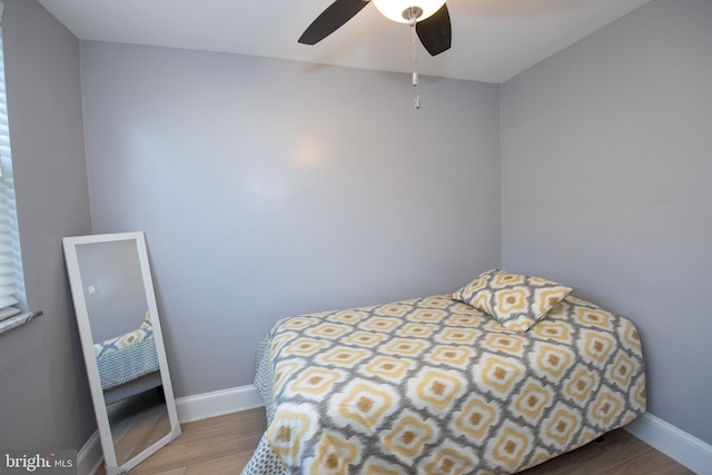 bedroom featuring hardwood / wood-style flooring and ceiling fan