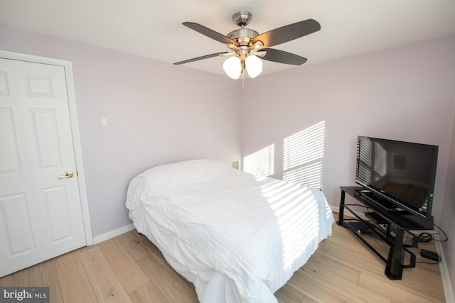 bedroom featuring ceiling fan and light hardwood / wood-style floors