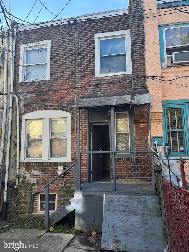 view of front of property featuring cooling unit