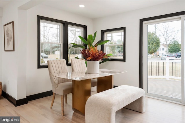 dining space featuring light hardwood / wood-style floors and a wealth of natural light