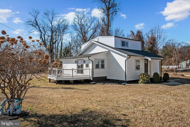 exterior space with a wooden deck and a yard