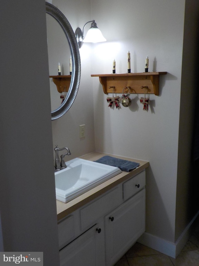 bathroom with tile patterned floors and vanity