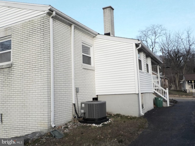 view of property exterior featuring central air condition unit