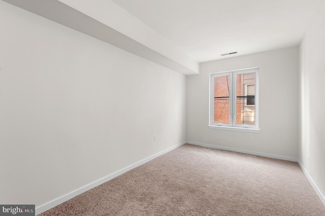 unfurnished room featuring carpet