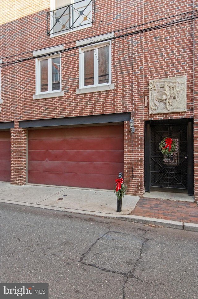 view of front of property with a garage