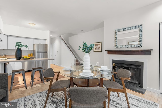 dining area featuring light parquet flooring