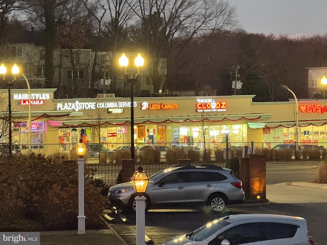 view of outdoor building at dusk