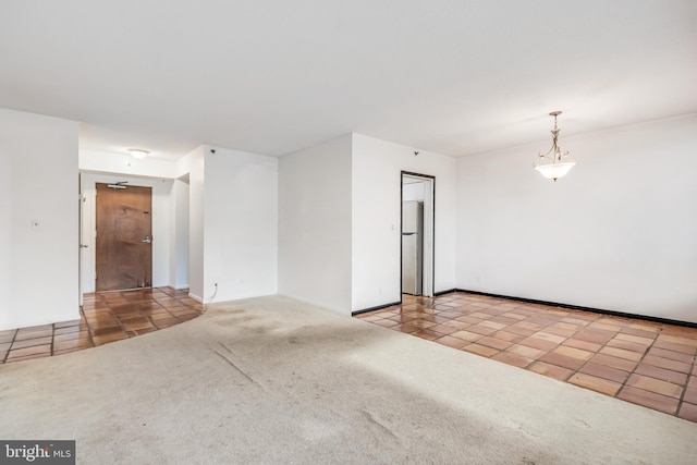 empty room with ceiling fan and carpet