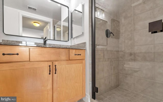 bathroom with vanity and walk in shower