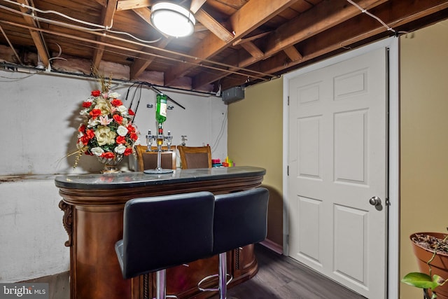 bar featuring dark hardwood / wood-style floors