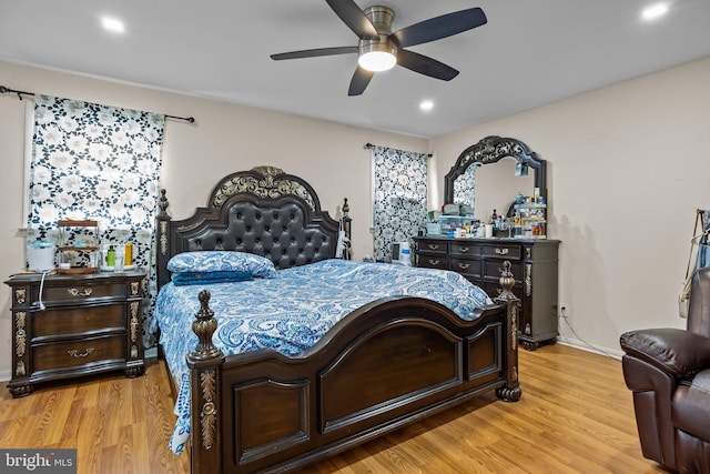 bedroom featuring ceiling fan and light wood-type flooring