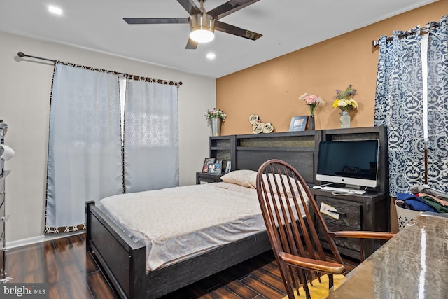 bedroom featuring ceiling fan and dark hardwood / wood-style flooring