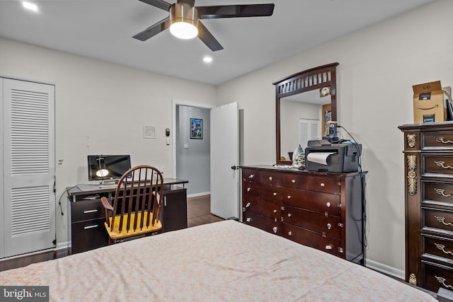 bedroom with hardwood / wood-style flooring and ceiling fan