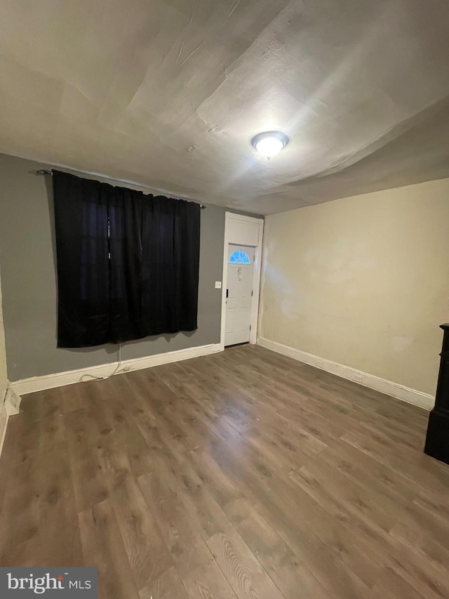 basement featuring wood-type flooring