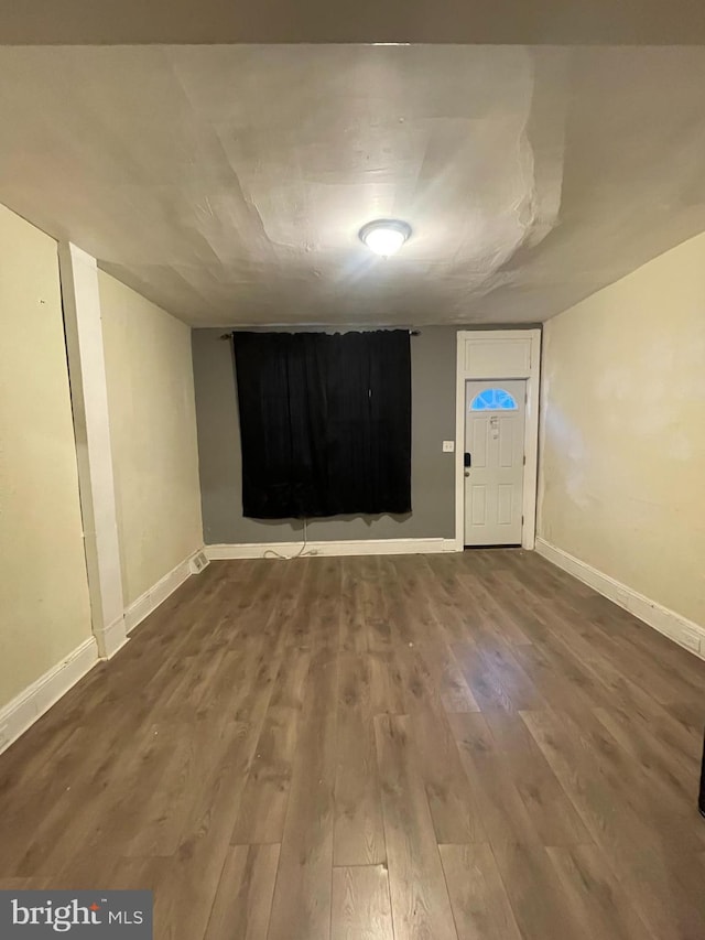 empty room with hardwood / wood-style flooring