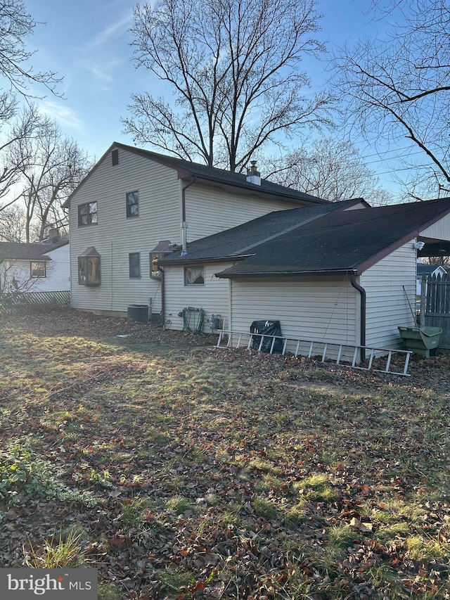 back of property featuring cooling unit