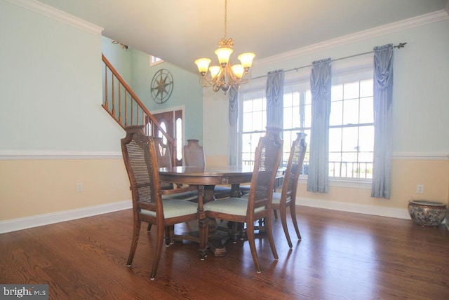 dining room featuring a notable chandelier, dark hardwood / wood-style floors, and ornamental molding