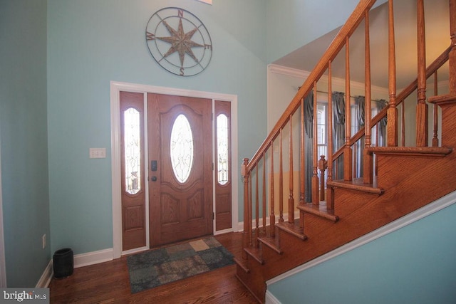 entryway with dark hardwood / wood-style floors