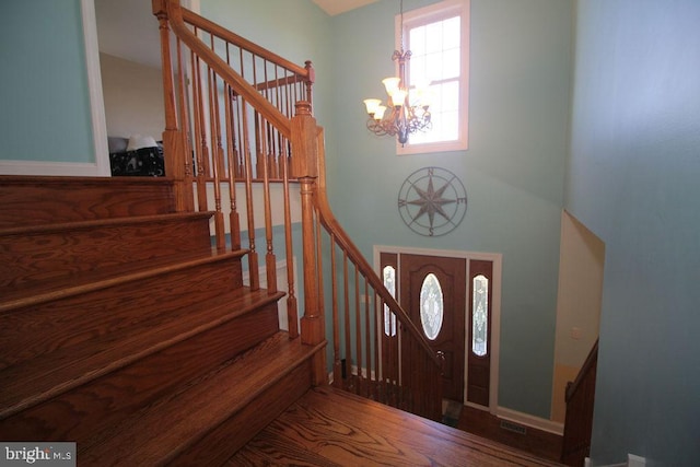 foyer entrance with an inviting chandelier