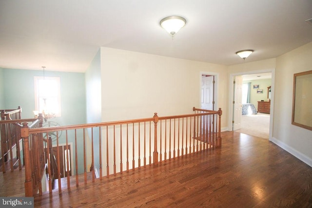 hall with dark wood-type flooring