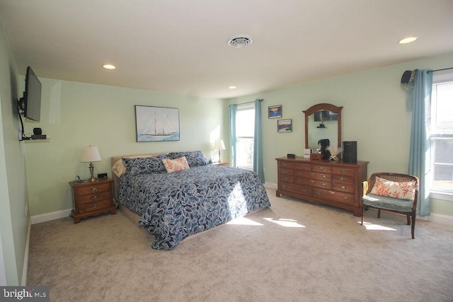 bedroom with light colored carpet