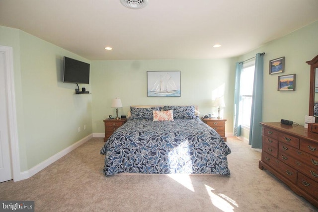 bedroom featuring light colored carpet