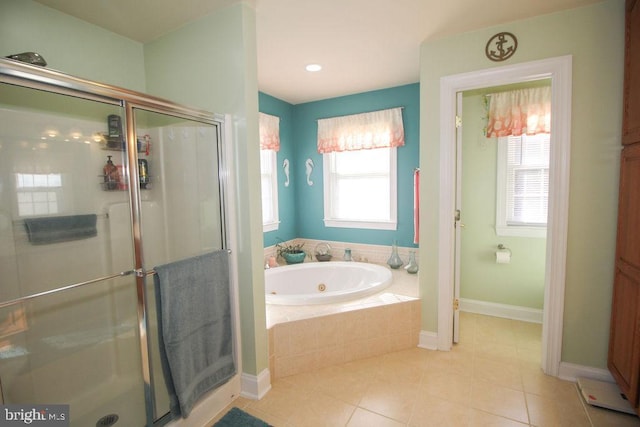 bathroom featuring tile patterned floors, a wealth of natural light, and independent shower and bath