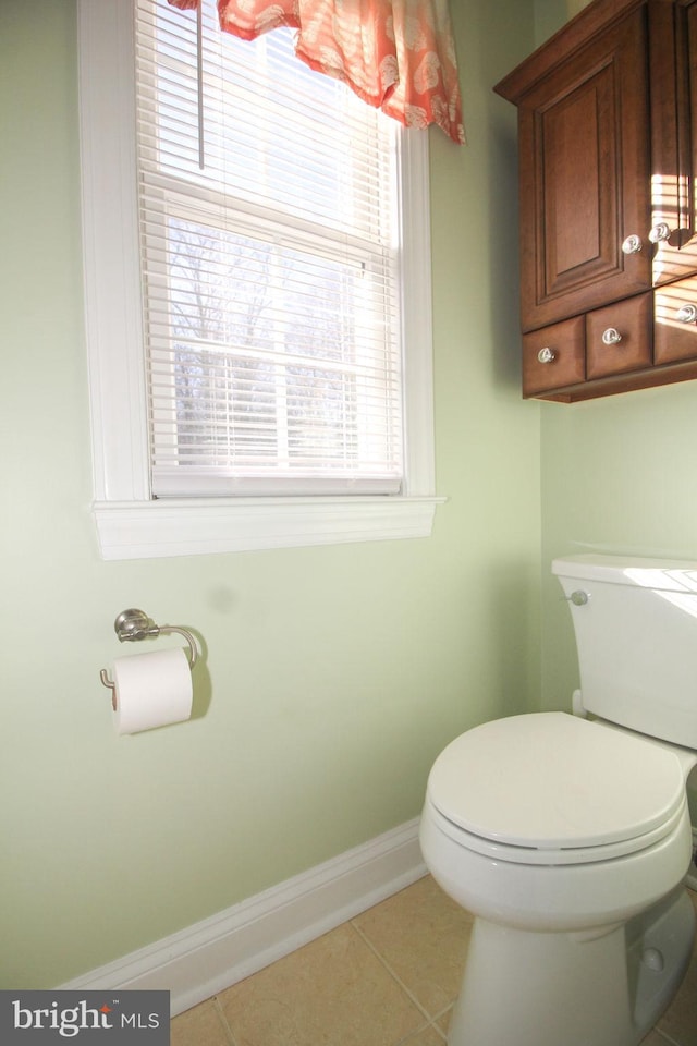 bathroom with tile patterned flooring and toilet