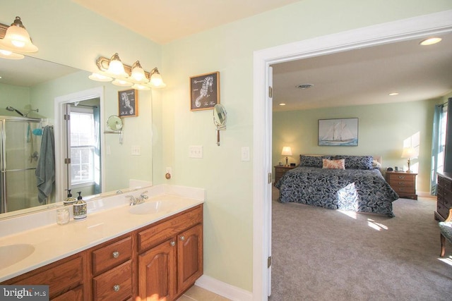 bathroom with vanity and walk in shower