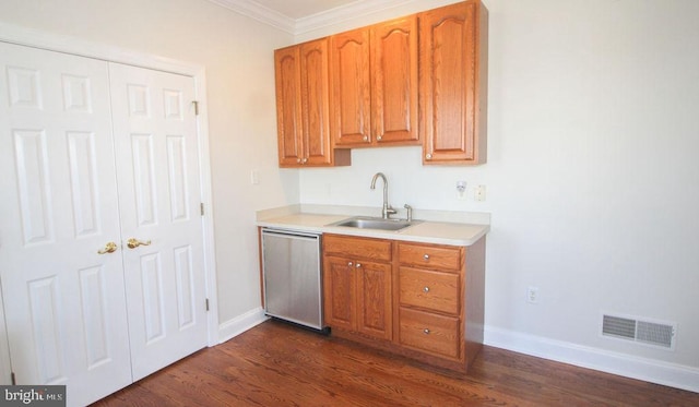 kitchen featuring dishwasher, dark hardwood / wood-style flooring, crown molding, and sink