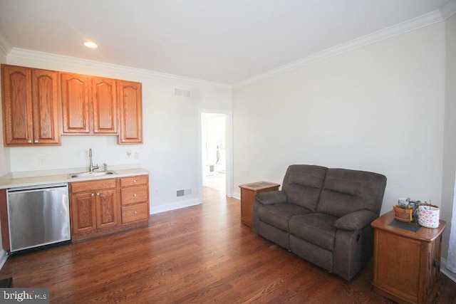 kitchen featuring dishwasher, dark hardwood / wood-style floors, ornamental molding, and sink