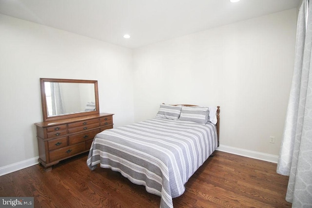 bedroom featuring dark hardwood / wood-style flooring