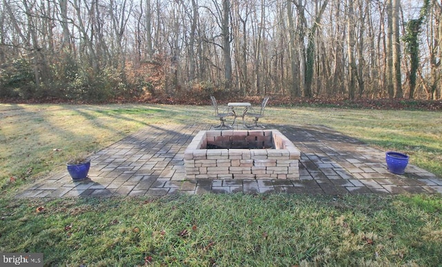 view of patio / terrace featuring a fire pit