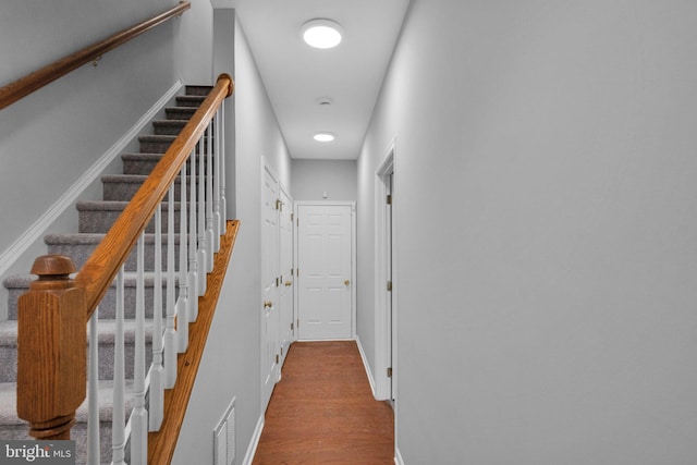 corridor with wood-type flooring