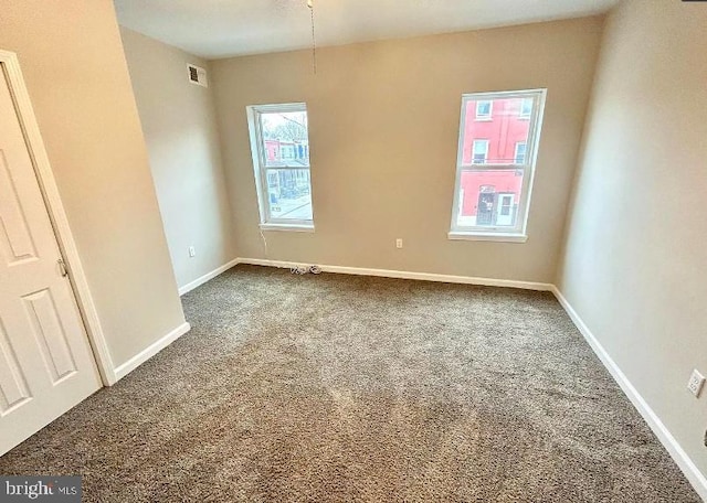 unfurnished room featuring carpet floors