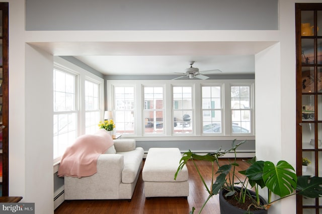 interior space featuring ceiling fan, plenty of natural light, and a baseboard radiator