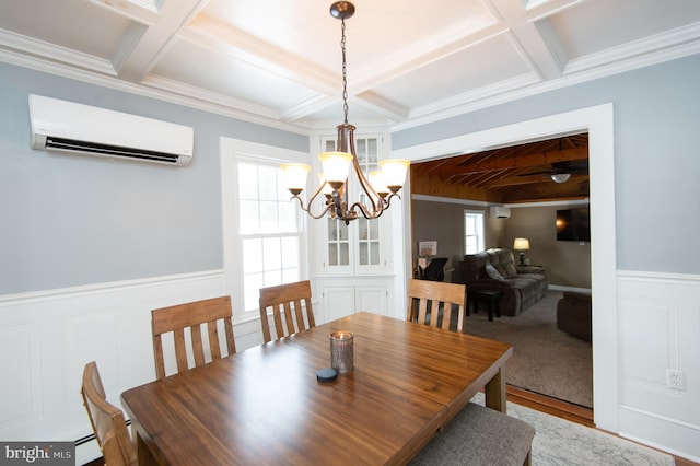 dining room featuring a baseboard radiator, ornamental molding, a wall unit AC, and coffered ceiling