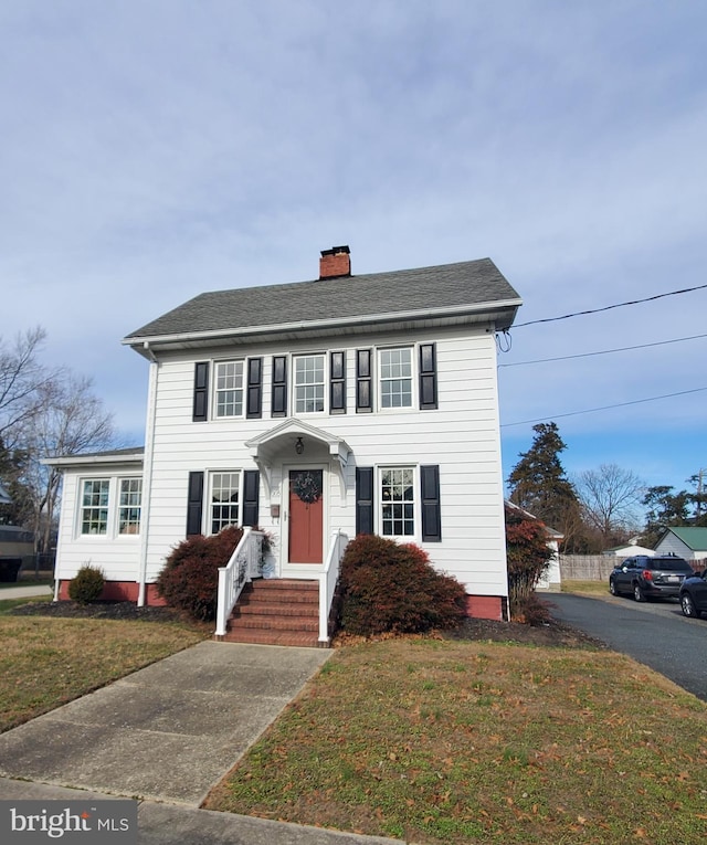 colonial house with a front lawn