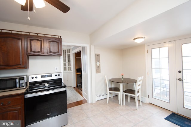 kitchen featuring french doors, dark brown cabinetry, stainless steel appliances, and a baseboard heating unit