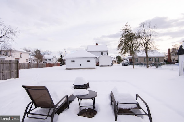 view of yard covered in snow