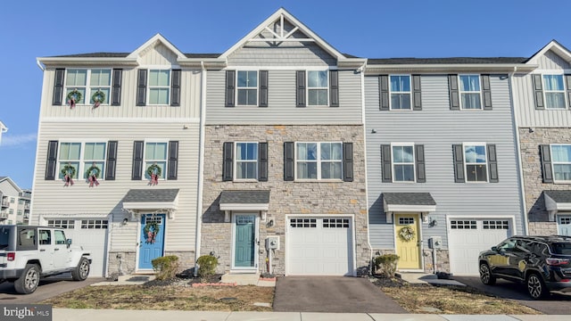 multi unit property featuring a garage