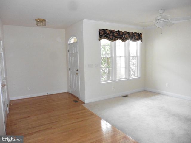 unfurnished room with hardwood / wood-style floors and ceiling fan