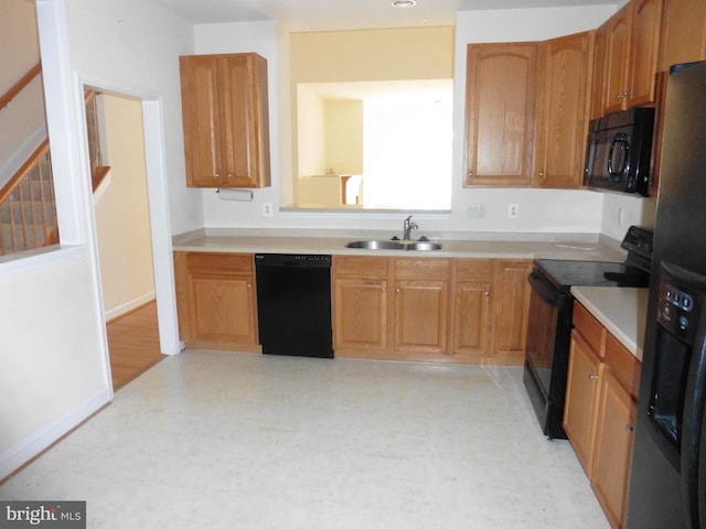 kitchen with sink and black appliances